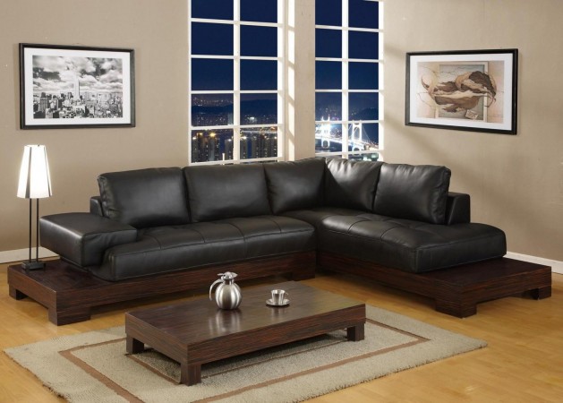 A black leather sectional sofa showcasing the allure of leather seating in a living room.