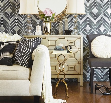 A living room with a black and white chevron wallpaper.