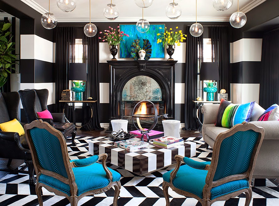A living room with bold, black and white striped walls.