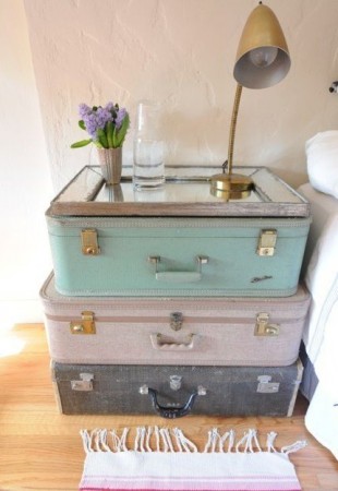 lovely nightstand made with old and colored suitcases