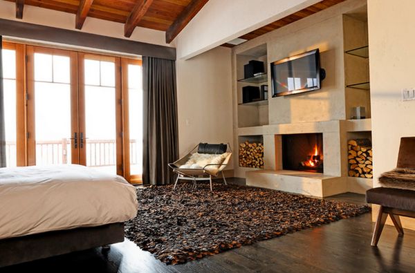 modern bedroom with a lovely fireplace