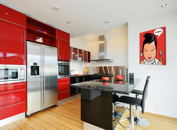 A kitchen with red cabinets and stainless steel appliances inspired by pop art.
