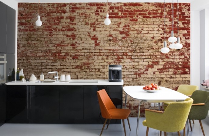 A modern kitchen with an attention-grabbing brick wall.