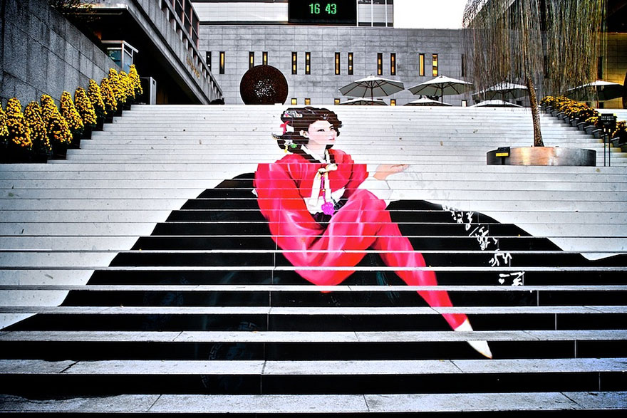 A woman is sitting on a set of steps.