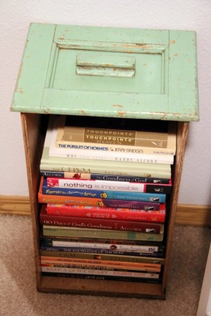 A stack of books on a bookcase.