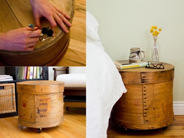 A person is repurposing a wooden crate into a nightstand.
