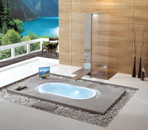A contemporary bathroom with a spacious tub and a waterfall.