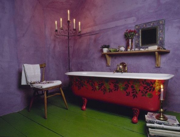 A bathroom with a green tub.