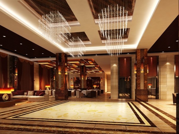 A hotel lobby with a chandelier and marble floor that showcases interior design.
