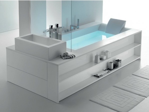 A white bathroom with a bathtub.
