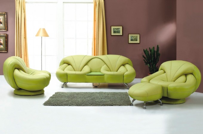 A living room with a unique green leather sofa.