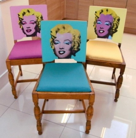 Three pop art marilyn monroe chairs in a kitchen.