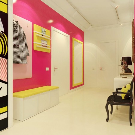 A vibrant pink and yellow room featuring pop art posters on the wall.