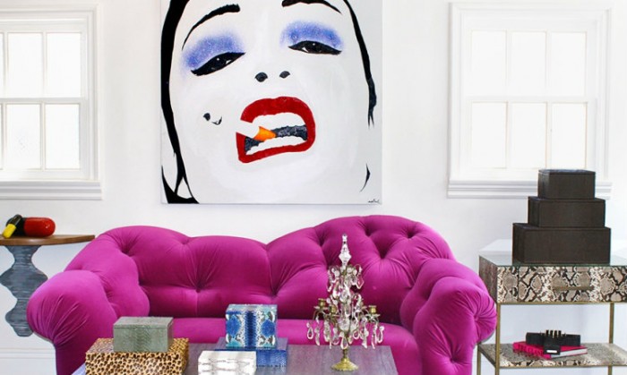 A living room with a pop art painting.