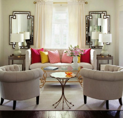 the use of mirrors enlarges the living room