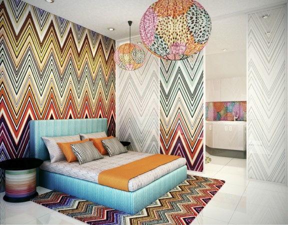 A colorful bedroom with graphic zig-zag patterns on the walls.