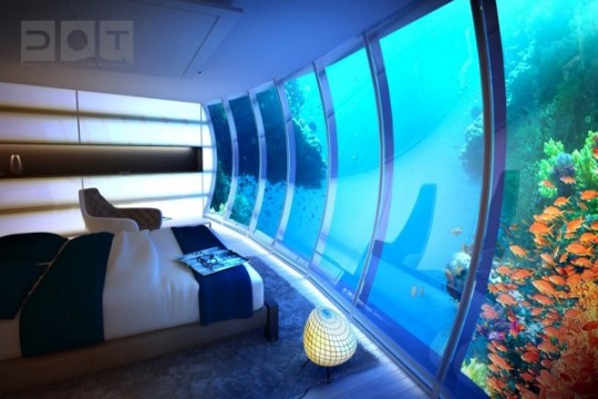 A bedroom with an aquarium.
