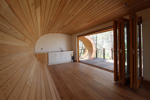 Beautiful wood paneling enhances this underground home interior 