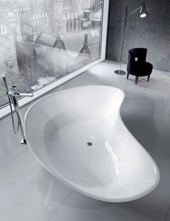 A white bathtub in a bathroom.