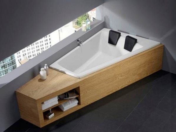 A wooden bathtub in a bathroom.