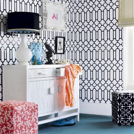 A room with bold graphic trellis wallpaper.