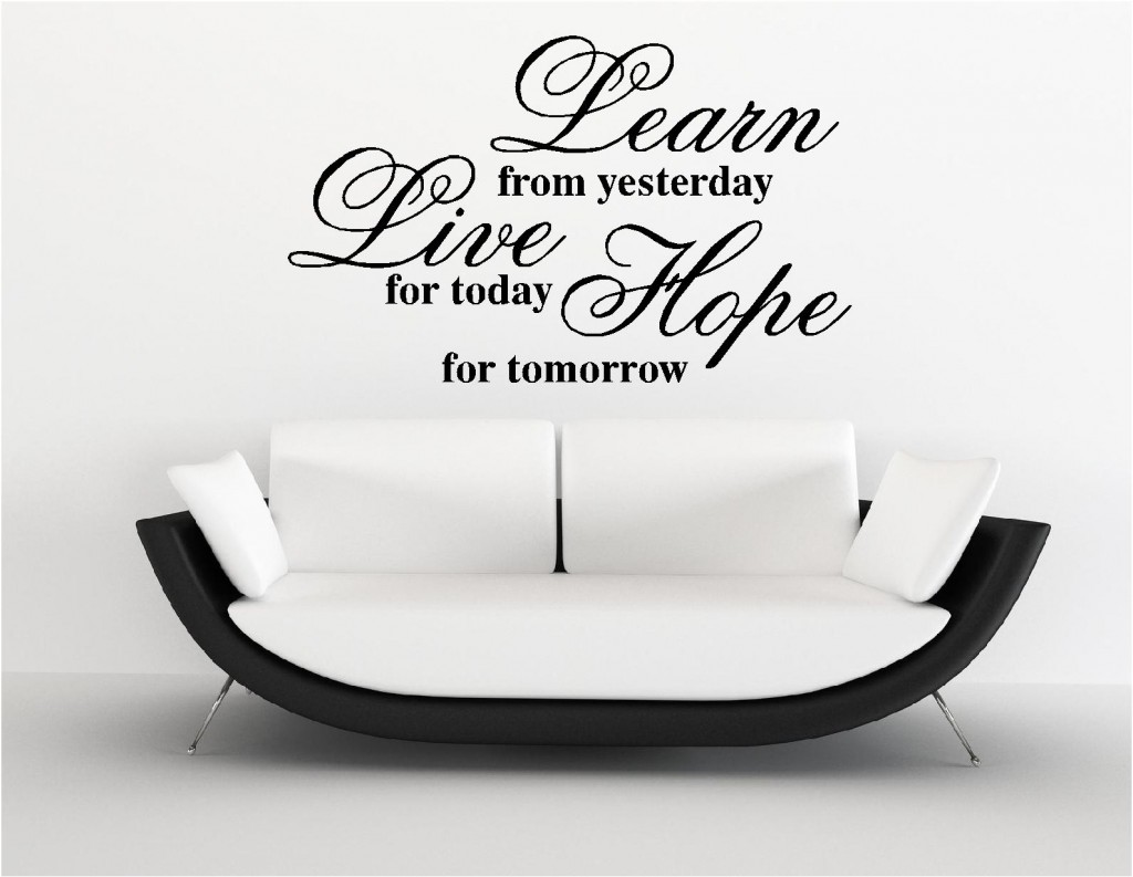 Wall decal featuring inspirational message and adorned with wall stickers.