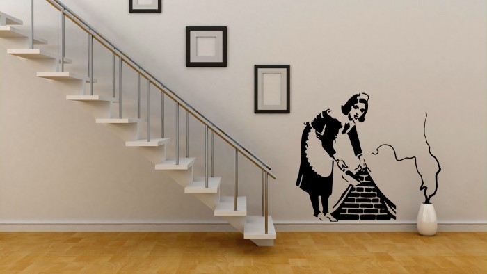 A woman cleaning chimney wall stickers.
