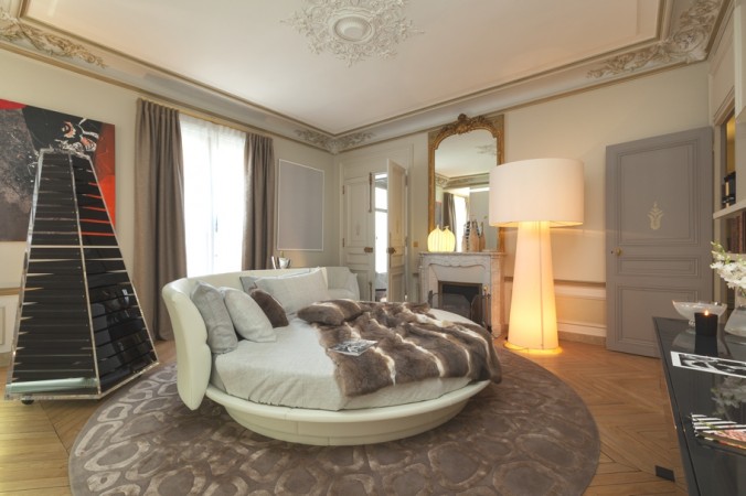 A round bed showcasing haute couture interior design in a bedroom.