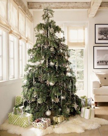 A large alternative Christmas tree in a living room.