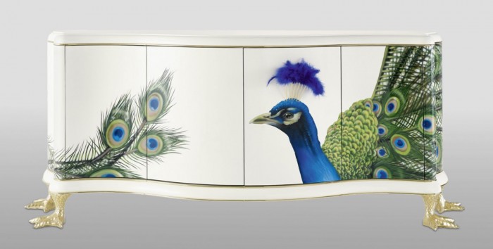 A white sideboard beautifully adorned with a peacock.