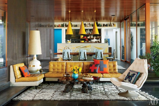 A living room with colorful furniture designed by Jonathan Adler, the King of Happy Chic.