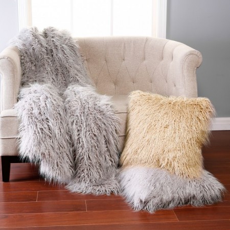 Fluffy blanket and pillow gives texture and warmth to interiors 