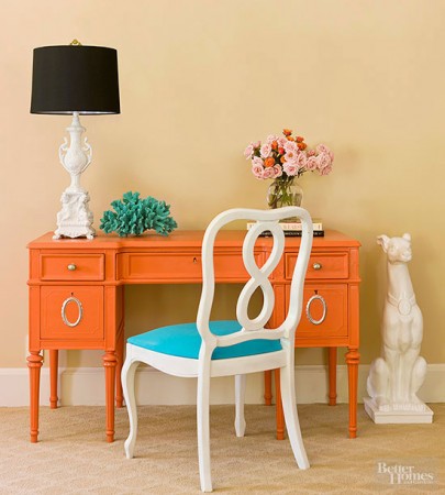 Give New Life to an orange desk with a white chair and lamp by using paint.