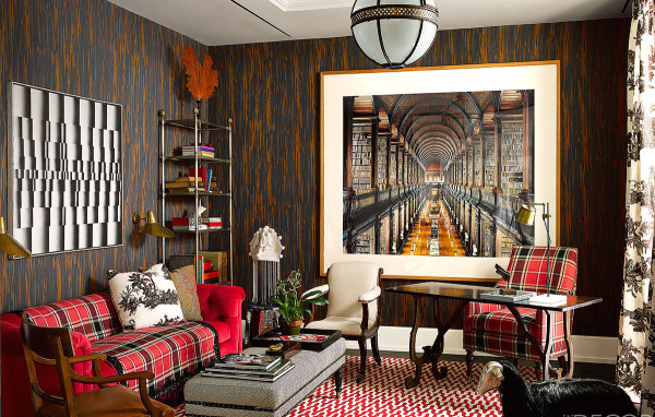 A cozy living room with a large painting on the wall, perfect for snuggling up.