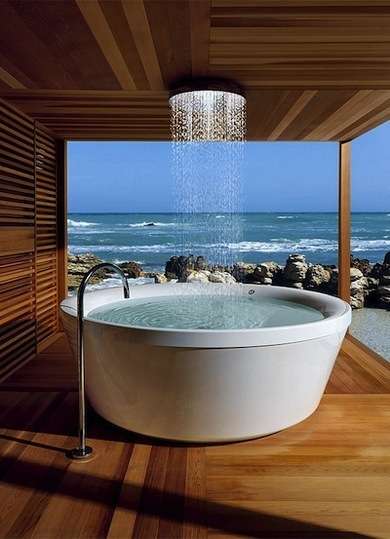 A relaxing whirlpool bath with an ocean view.