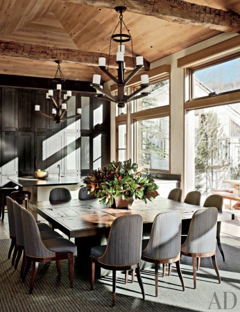 A rustic dining space with a large table and chairs.