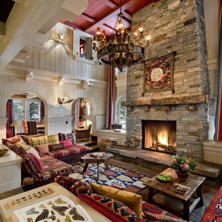 A lodge-style living room with a fireplace.