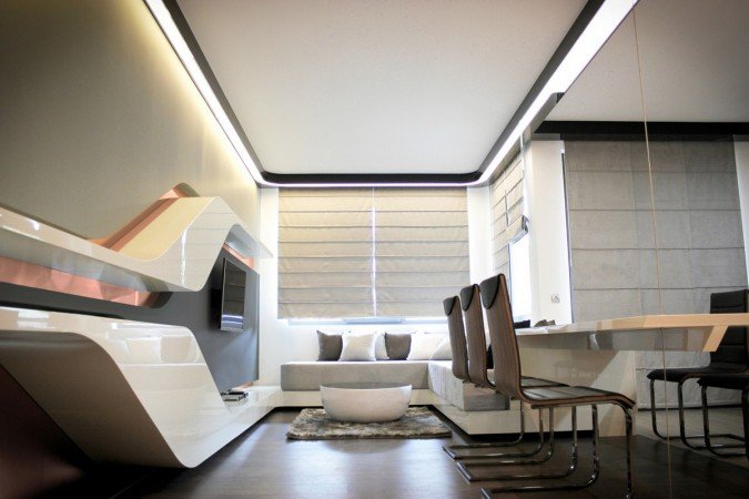 A futuristic living room with a TV and a dining table.