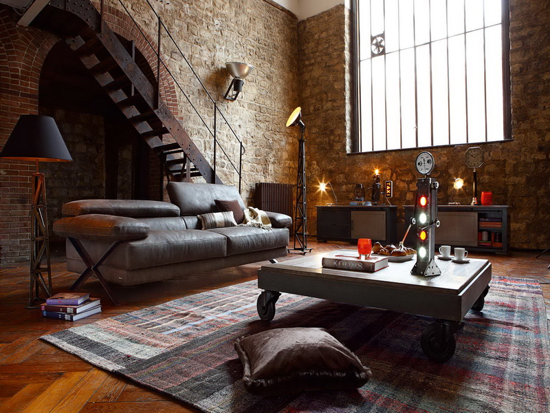 A living room with a masculine and industrial style, featuring a fireplace and staircase.