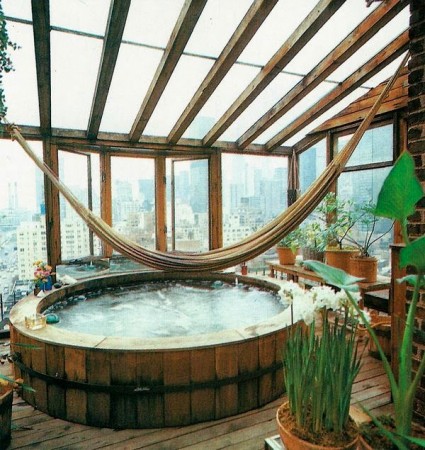 Relax at home with a wooden deck and hot tub.