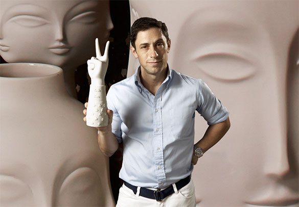 A man standing in front of a group of vases with Designer Focus: Jonathan Adler.