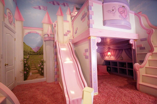 A kids room with a castle and slide.