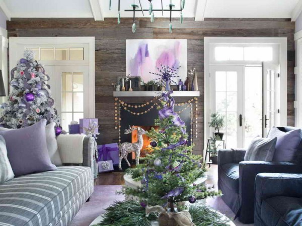 A living room decorated for Christmas with an alternative purple tree.