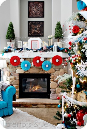 A living room adorned with a festive Christmas tree and decorations.