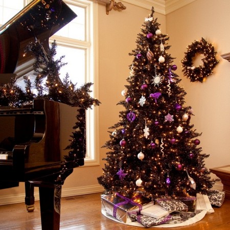 An alternative Christmas tree in front of a piano.