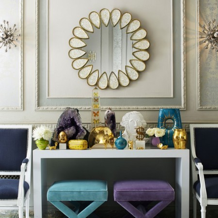 A table with a mirror and stylish stools designed by Jonathan Adler, the King of Happy Chic.