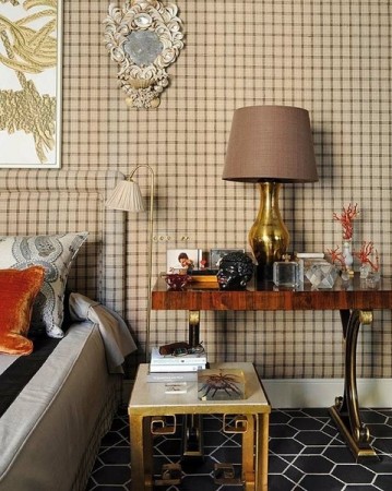 A subtle plaid wallpaper gives this room dimension