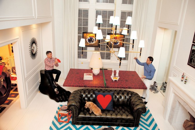 A living room with a ping pong table designed by Jonathan Adler, the King of Happy Chic.