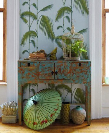Creating a Tropical Paradise at Home with a table and palm tree.