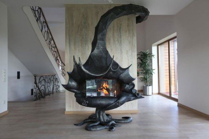 A black fireplace with a futuristic dragon on it.